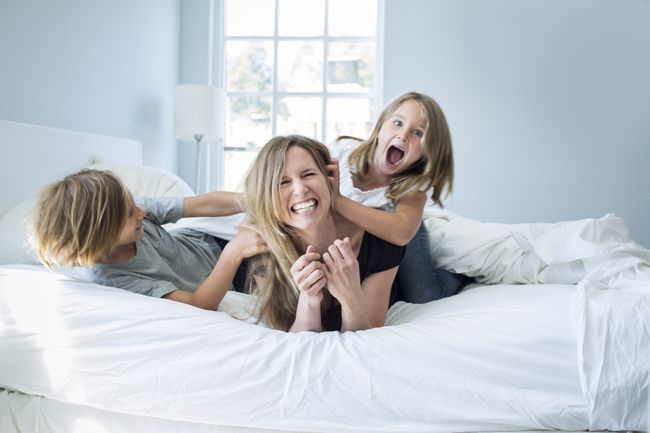 Getty_mom_kids_laughing_bed_large.jpg