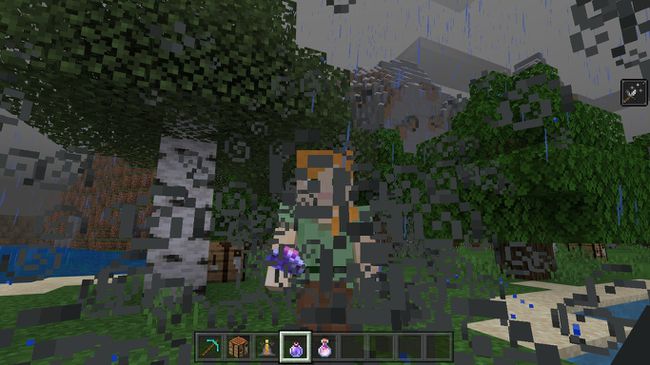 Minecraft में एक लिंगरिंग पोशन क्लाउड में खड़ा खिलाड़ी