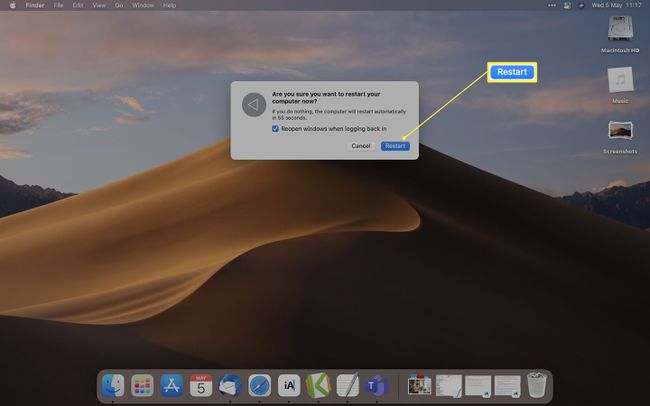再起動ダイアログで再起動が強調表示されたMacOSデスクトップ