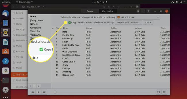 Снимок экрана Rhythmbox с выделенным флажком Копировать файлы