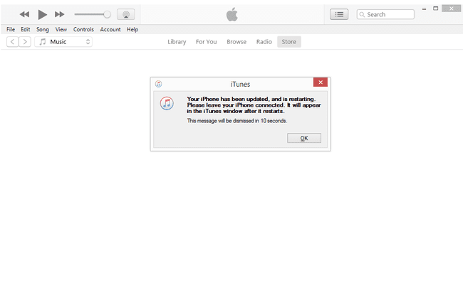 iTunes-viesti, jossa lukee iPhonesi on päivitetty ja käynnistyy uudelleen