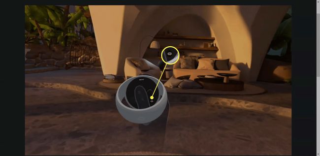 VR のタッチ コントローラーで強調表示された Oculus ボタン。