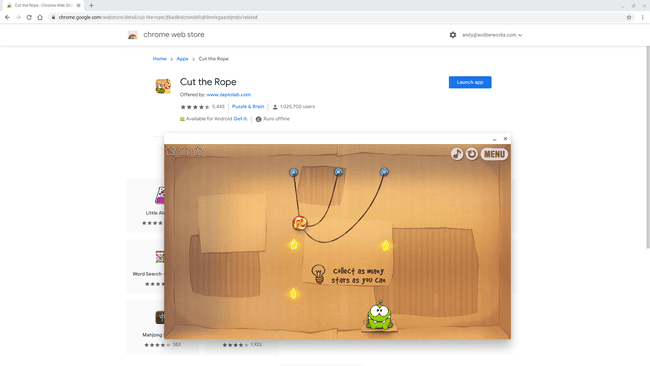 Στιγμιότυπο οθόνης του Cut the Rope σε τμήμα της οθόνης, με τη σελίδα Chrome Web Store για το παιχνίδι στο παρασκήνιο