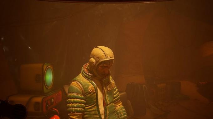 Snímek obrazovky The Invincible s postavou v jeskyni.