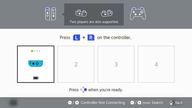 Um Joy Con conectado a um Nintendo Switch com os outros controles desligados.