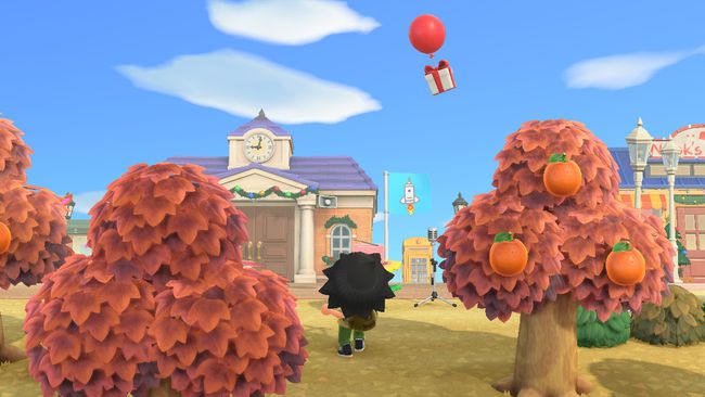 Postavička Animal Crossing sa pripravuje na streľbu z praku na plávajúci darček